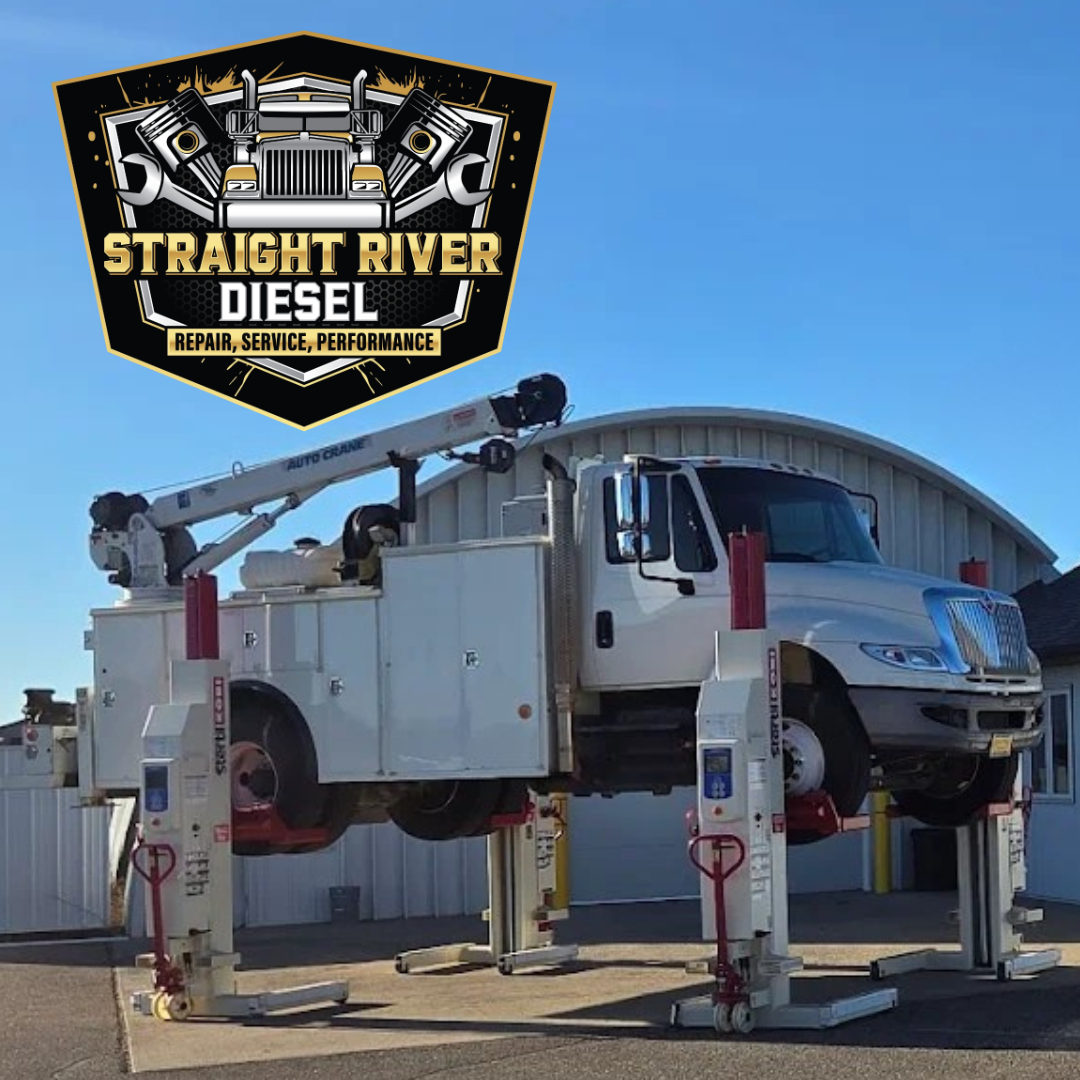Service truck on column lifts at the Straight River Diesel shop in Park Rapids, MN
