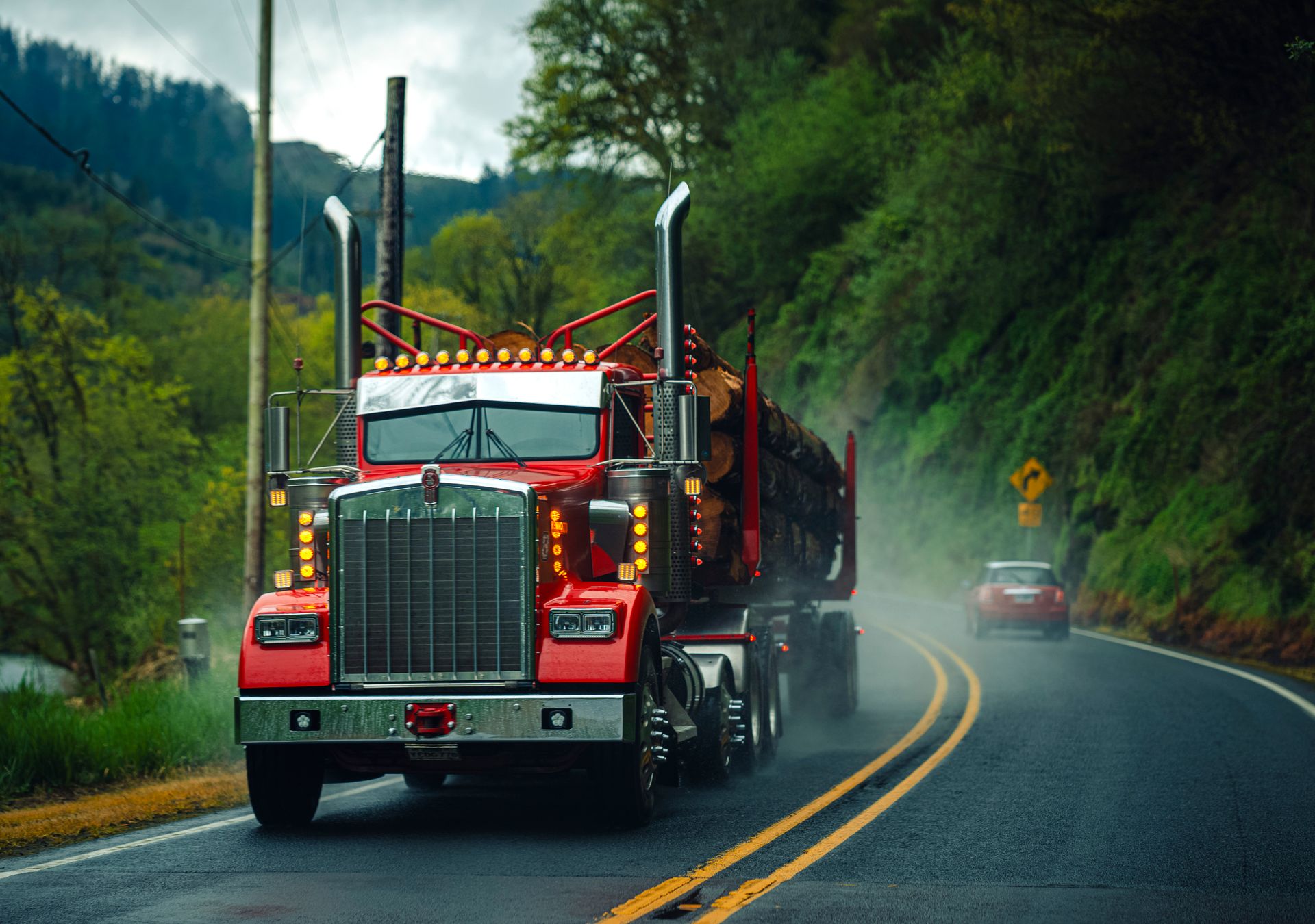 Log truck on a misty northwoods highway